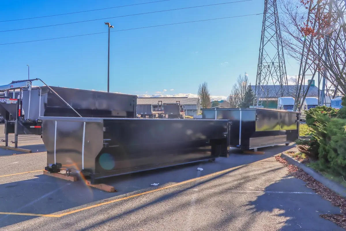 Roll-off dumpster ready for waste disposal at job site for Yard Waste Dumpster Rental in Burlington